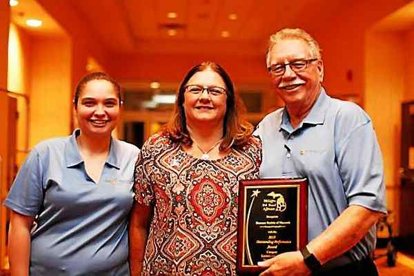HSM receiving the most-improved save rate award from the Michigan Pet Fund Alliance.